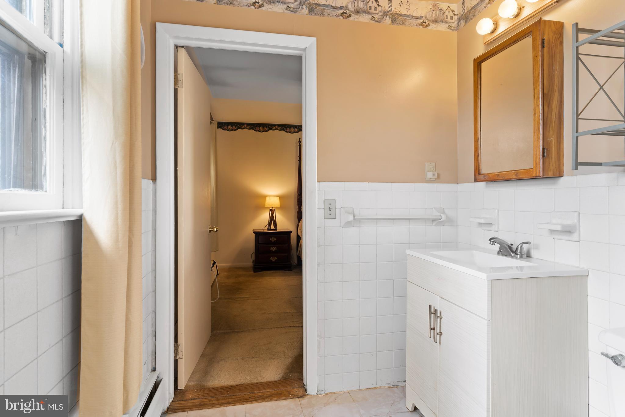 335 Wolfs Bridge Road Carlisle, PA 17013 - Photo 21 of 37 a bathroom with a sink and a mirror