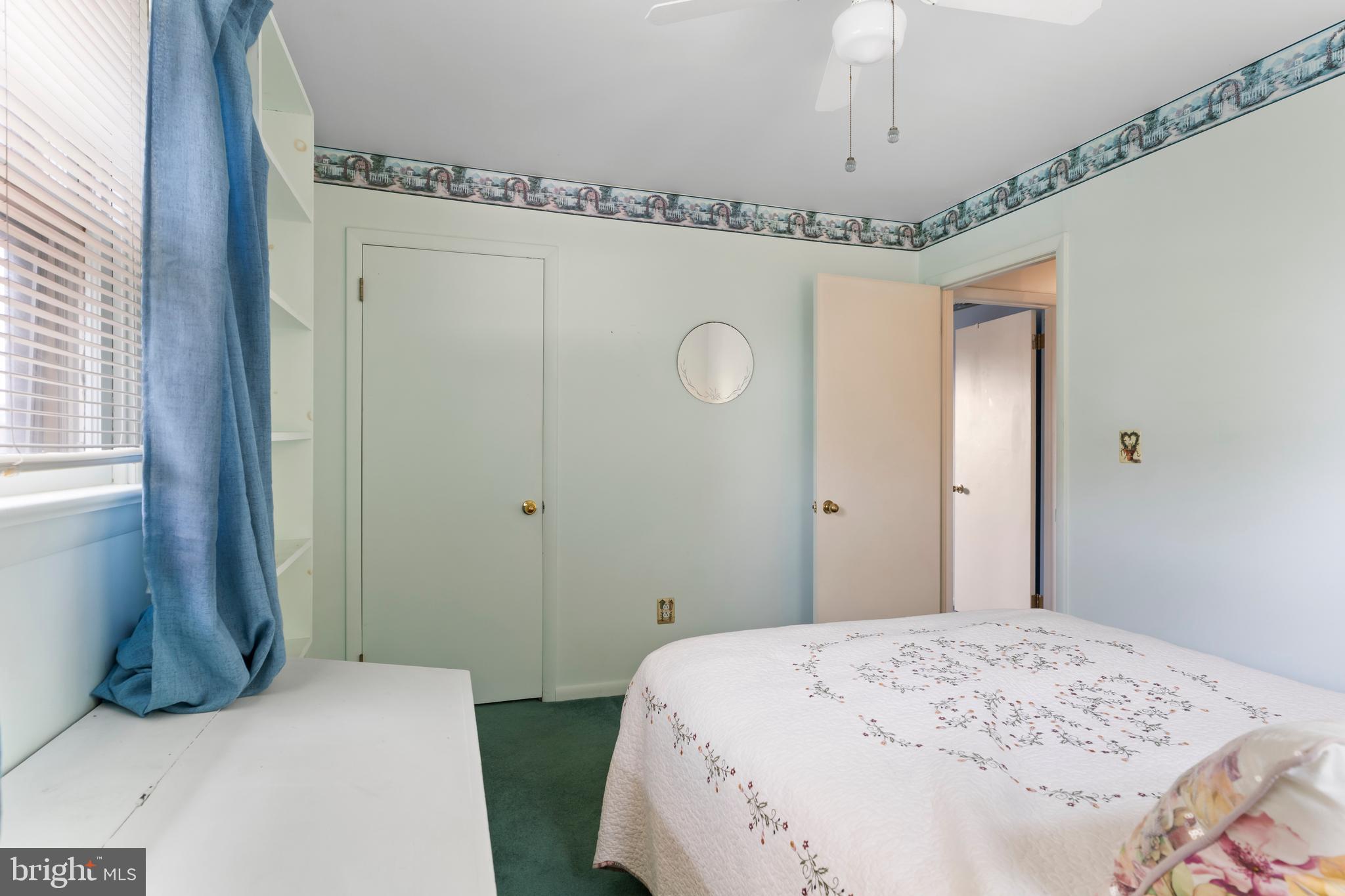 335 Wolfs Bridge Road Carlisle, PA 17013 - Photo 26 of 37 a bedroom with a bed and a chandelier