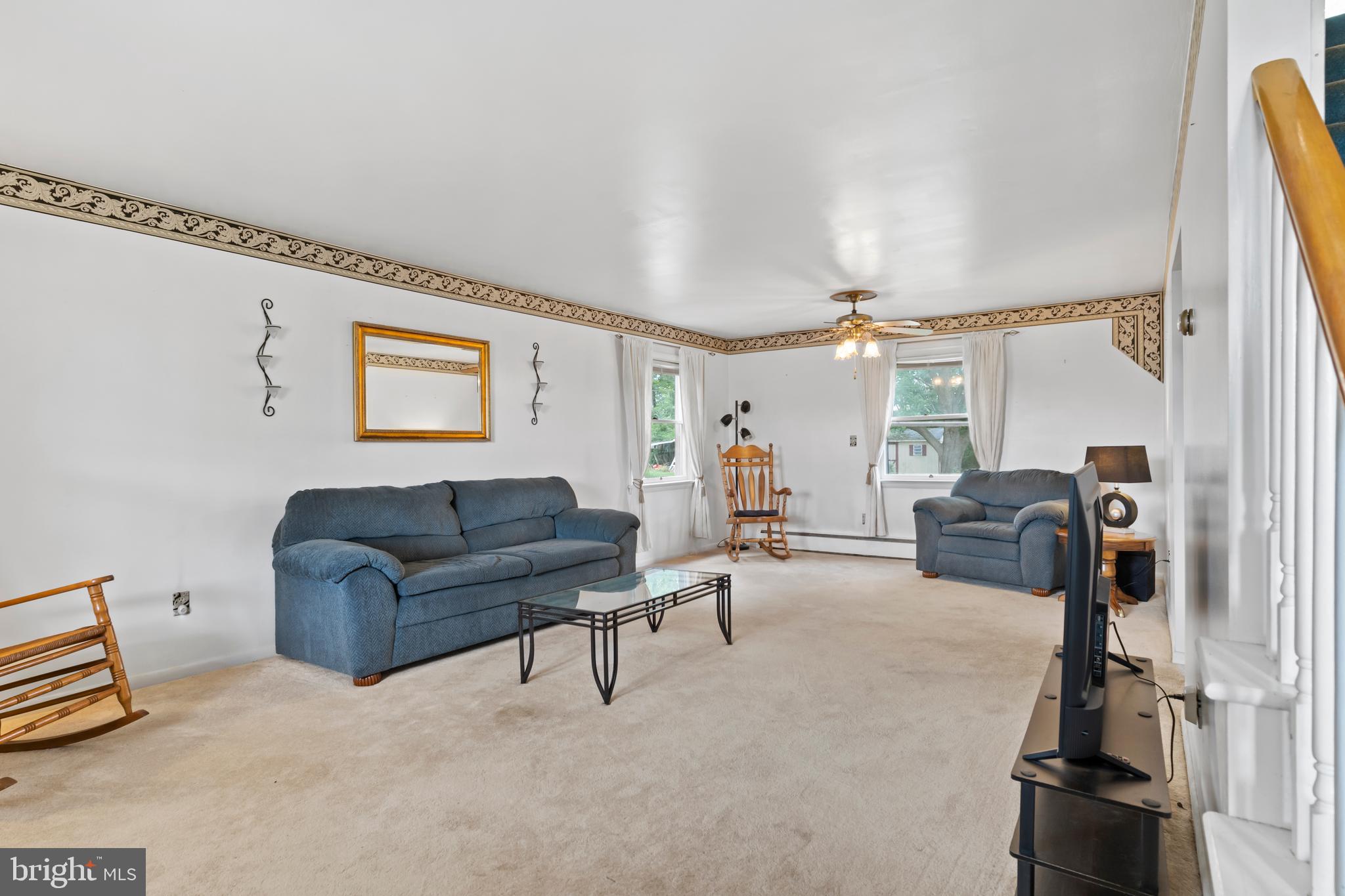 335 Wolfs Bridge Road Carlisle, PA 17013 - Photo 4 of 37 a living room with furniture and a flat screen tv