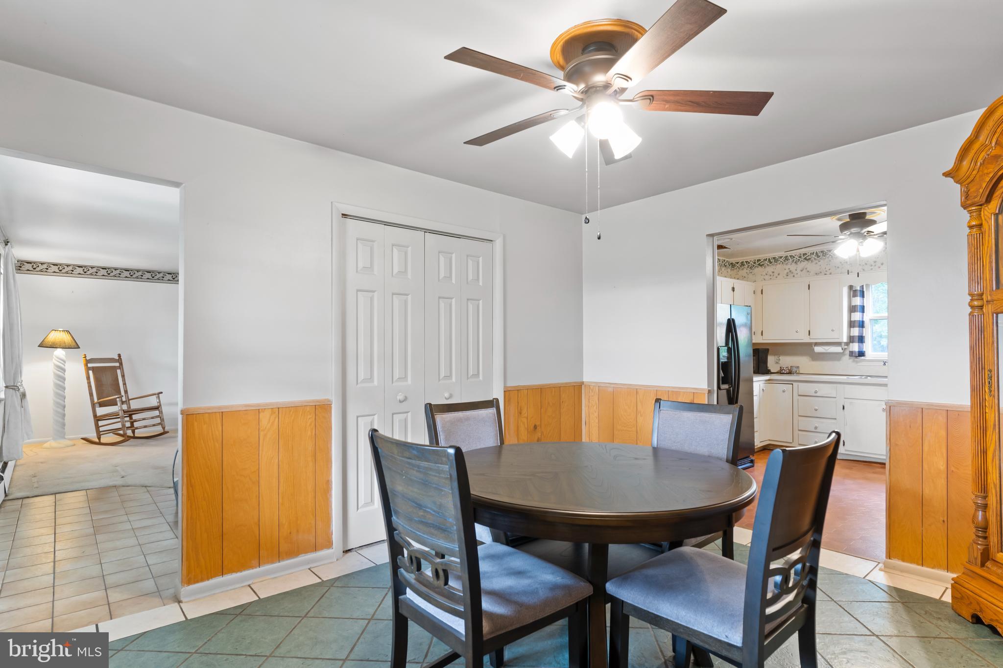 335 Wolfs Bridge Road Carlisle, PA 17013 - Photo 10 of 37 a view of a dining room with furniture and wooden floor