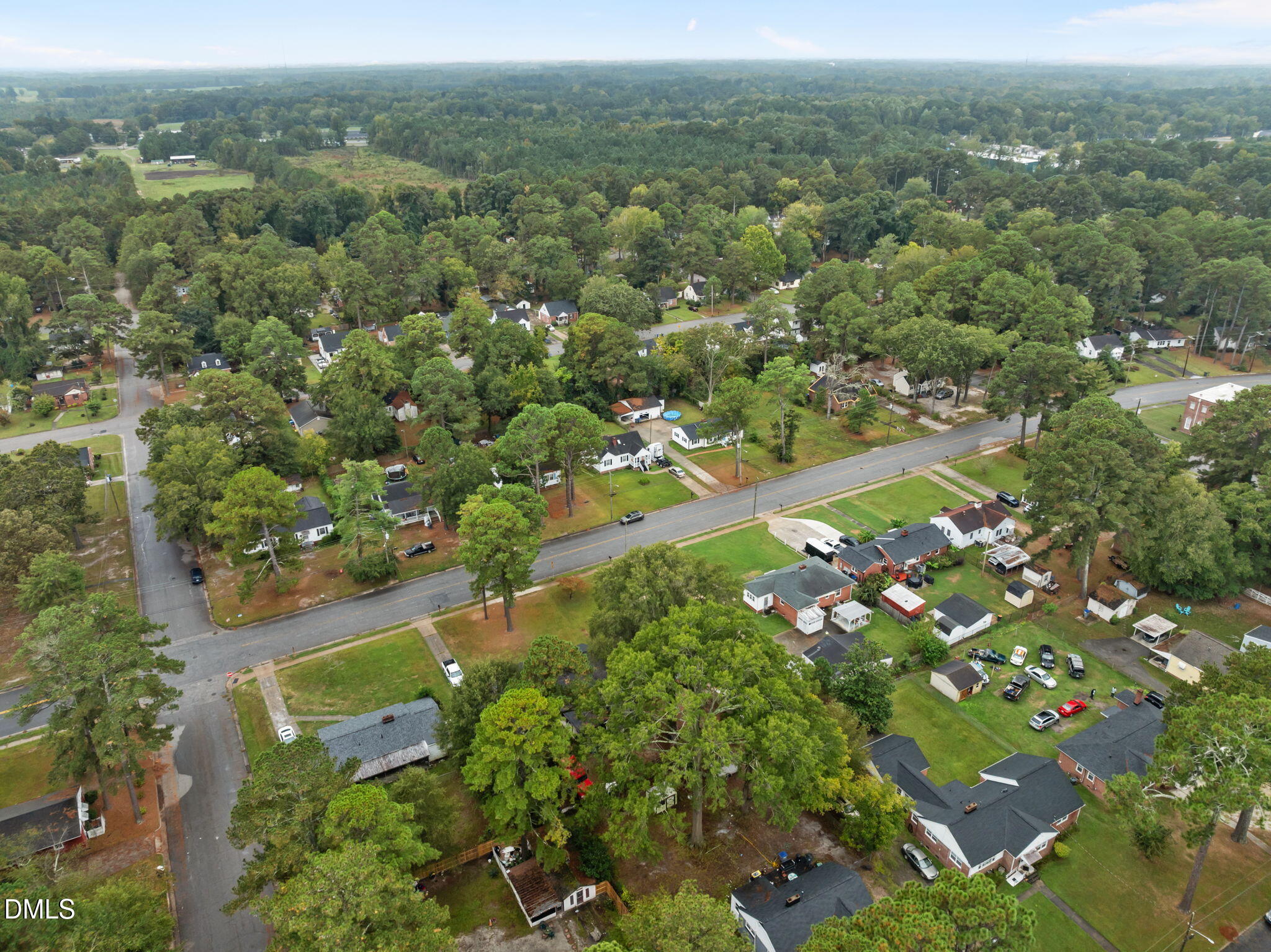 1220 Tarboro Street Rocky Mount, NC 27801 - Photo 14 of 47 an aerial view of residential houses with outdoor space and trees