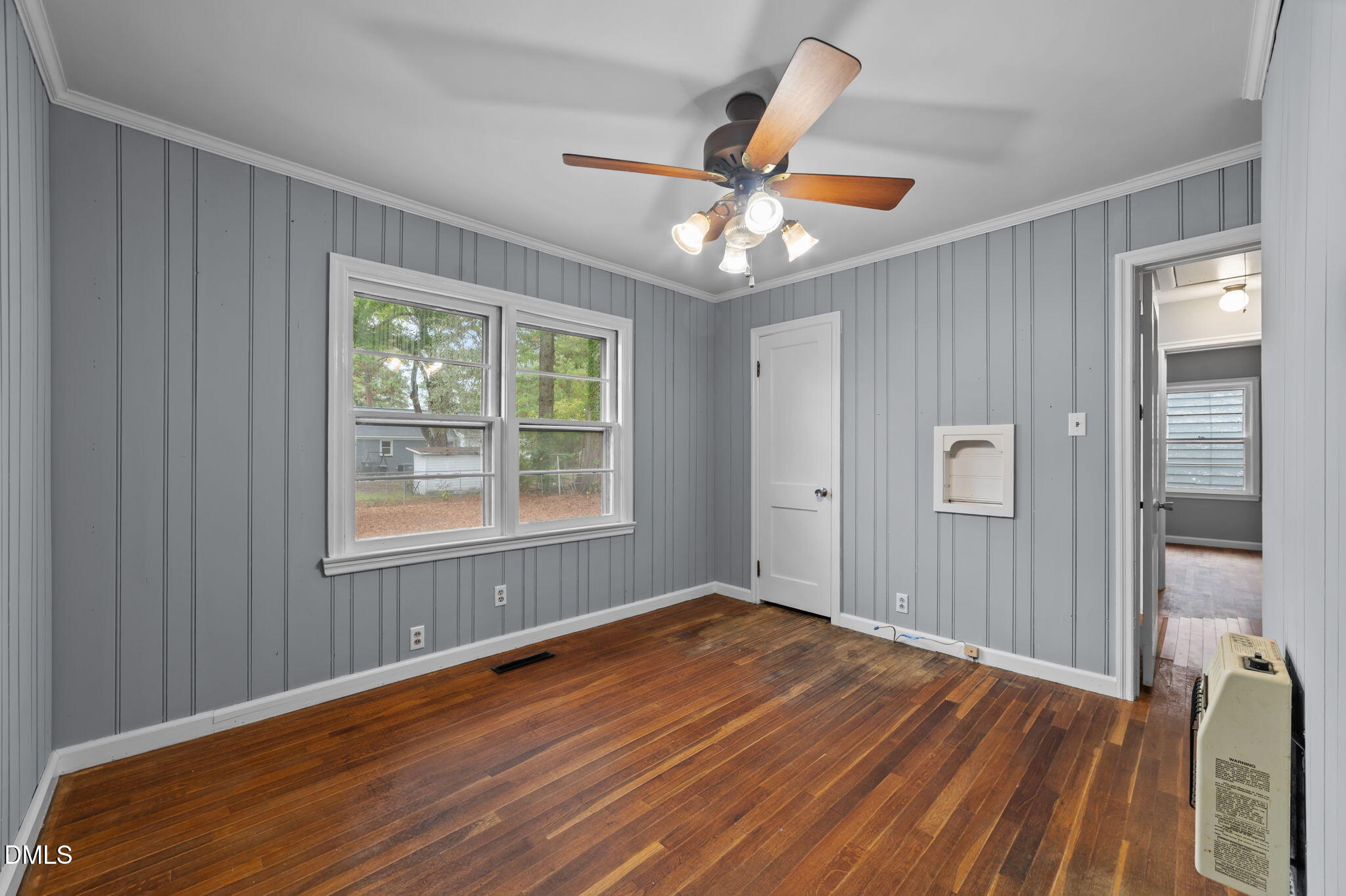 1220 Tarboro Street Rocky Mount, NC 27801 - Photo 29 of 47 a view of empty room with wooden floor and fan