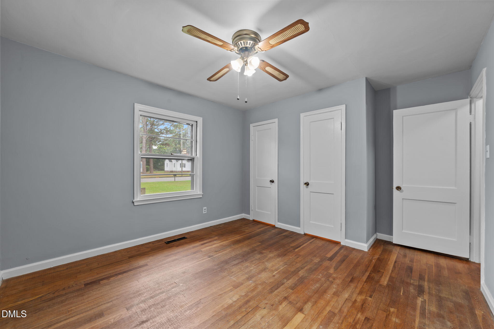 1220 Tarboro Street Rocky Mount, NC 27801 - Photo 33 of 47 wooden floor in an empty room with a window