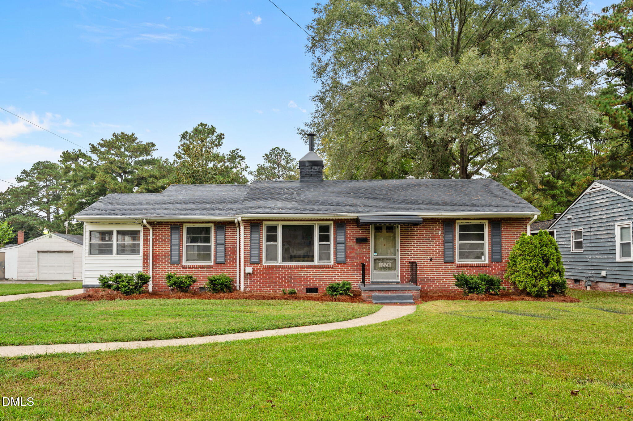 1220 Tarboro Street Rocky Mount, NC 27801 - Photo 6 of 47 a front view of house with yard and green space