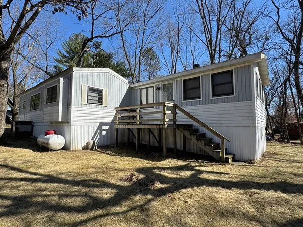 a view of a house with a snow in the yard