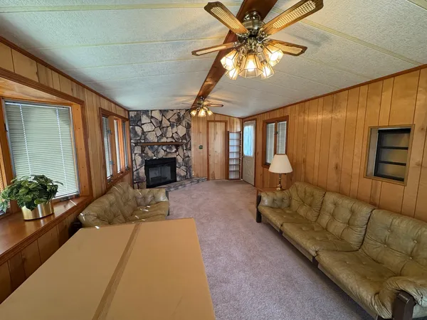 a bedroom with furniture and a chandelier