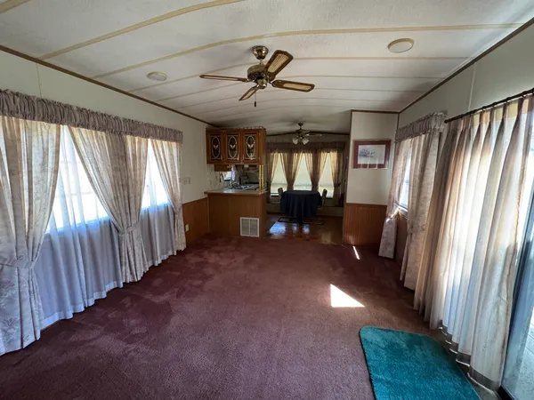 a view of a livingroom with furniture window wooden floor and furniture