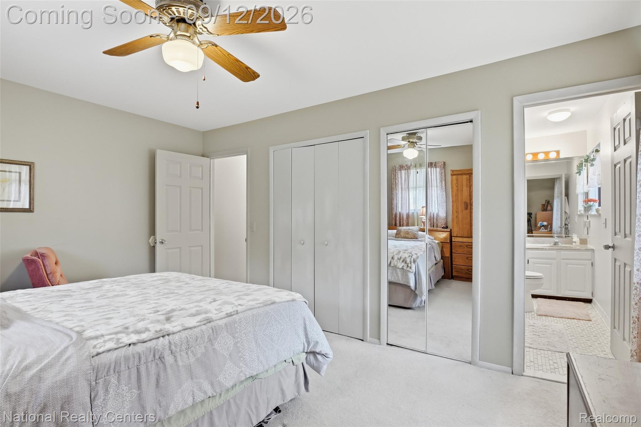2631 Garden Road Milford, MI 48381 - Photo 10 of 40 Carpeted room with a ceiling fan, closet with bifold doors, and a mirrored closet