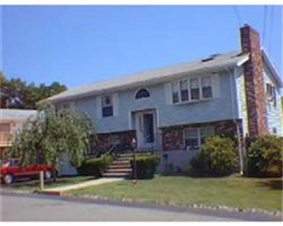 165 Fern Road Medford, MA 02155 - Photo 1 of 1 a front view of a house with a yard