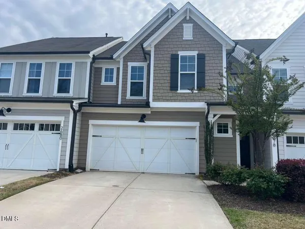 a front view of a house with garage