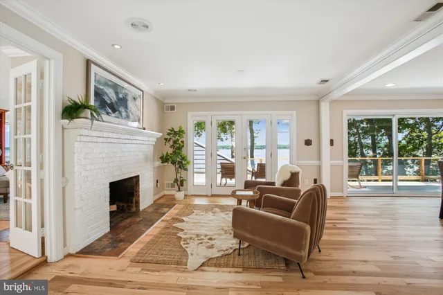 a view of a kitchen with furniture and wooden floor