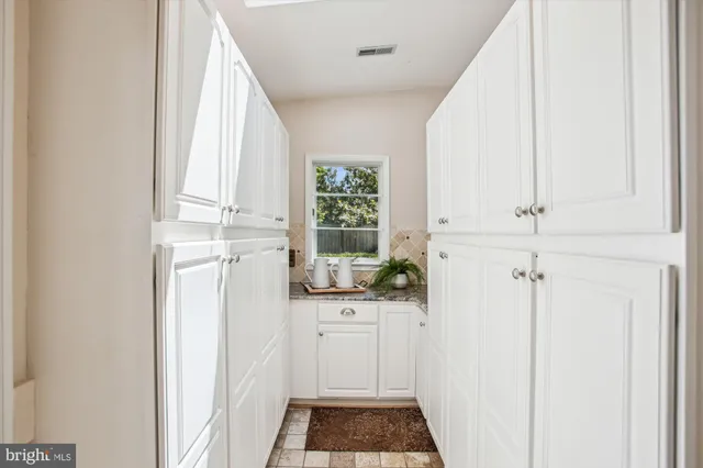 a view of a chairs and table in the roof deck