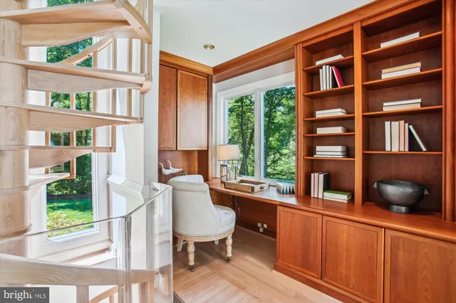 a very nice looking room with a large window and chandelier