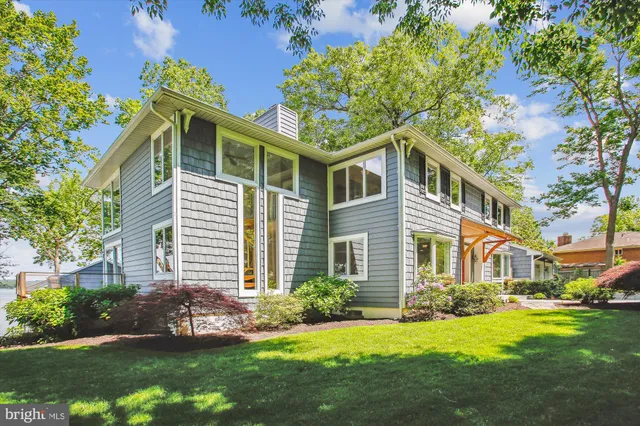 a living room with furniture and windows