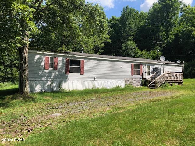 213 Slish Road Honesdale, PA 18431 - Photo 3 of 13 a view of a backyard with plants and a backyard