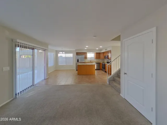 a view of empty room with a ceiling fan