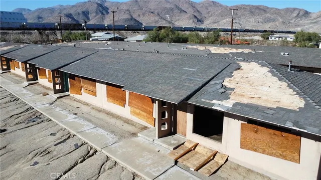 a view of a porch with wooden floor and stairs