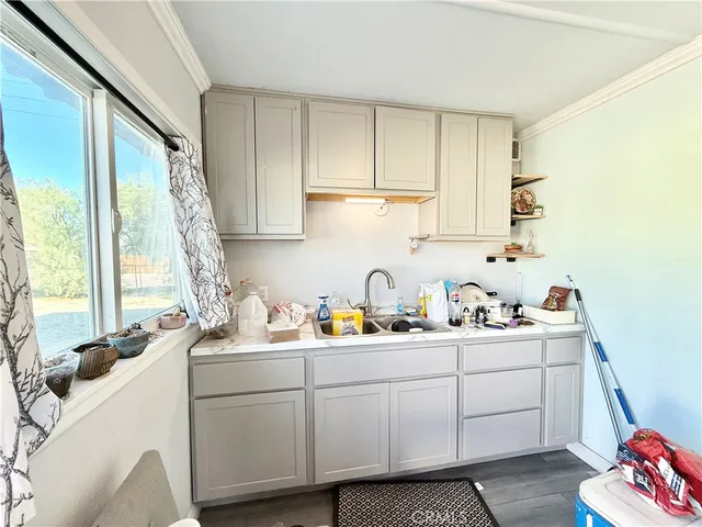 a kitchen with a stove and a refrigerator
