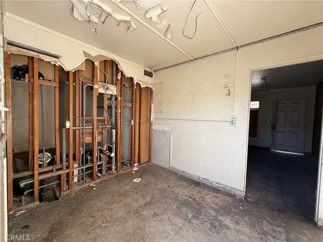 a living room with furniture and a ceiling fan