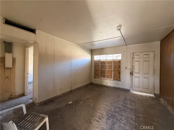 a view of living room with furniture and wooden floor