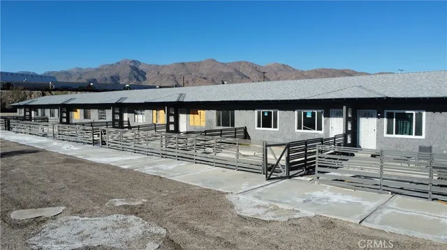 a view of a large building with a mountain in the background
