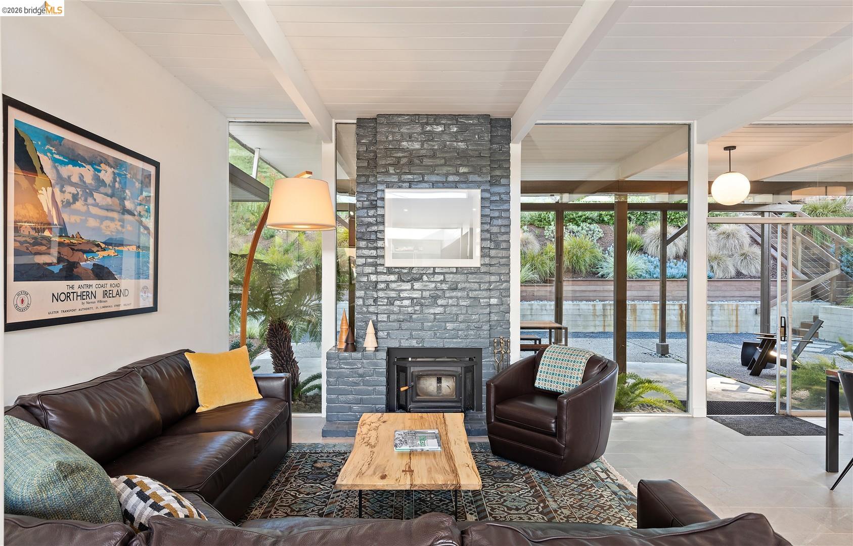 841 Montecillo Road San Rafael, CA 94903 - Photo 10 of 49 a living room with furniture fireplace and a large window