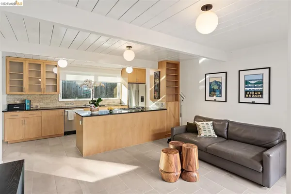 a kitchen with stainless steel appliances granite countertop a stove and a sink