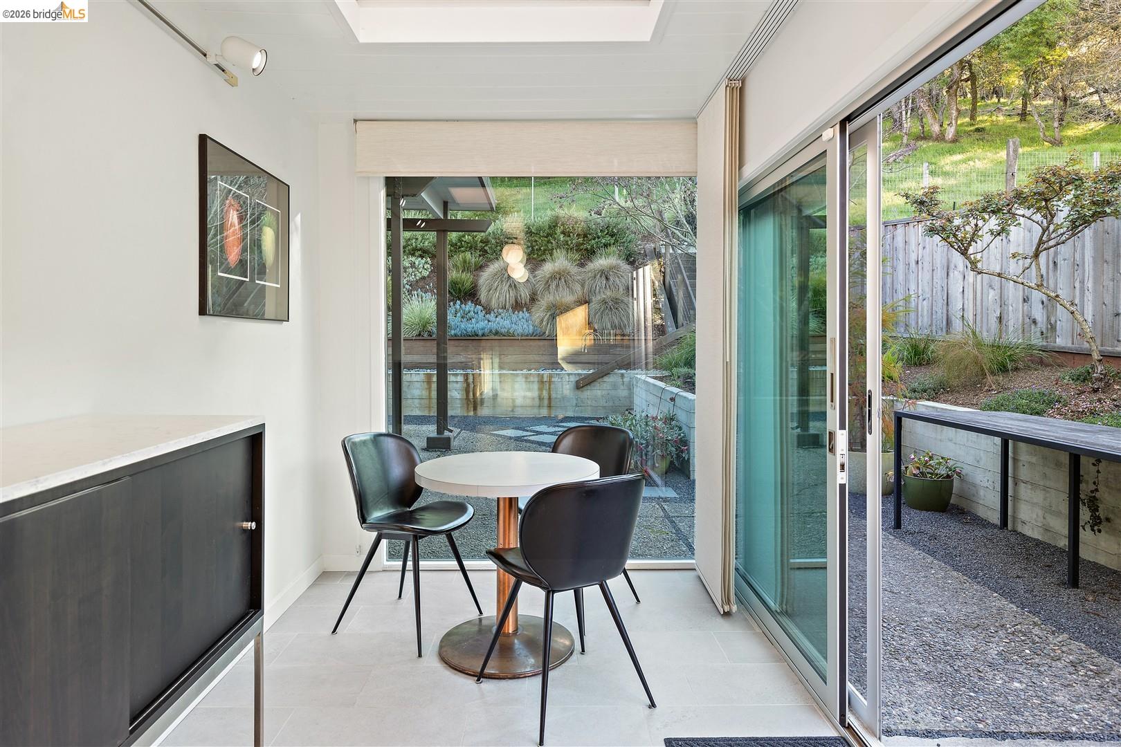 841 Montecillo Road San Rafael, CA 94903 - Photo 18 of 49 a dining room with furniture and a floor to ceiling window