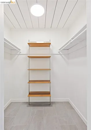 a view of a bedroom with closet and cabinet