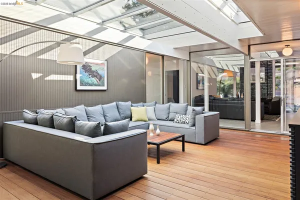 a living room with furniture and a rug