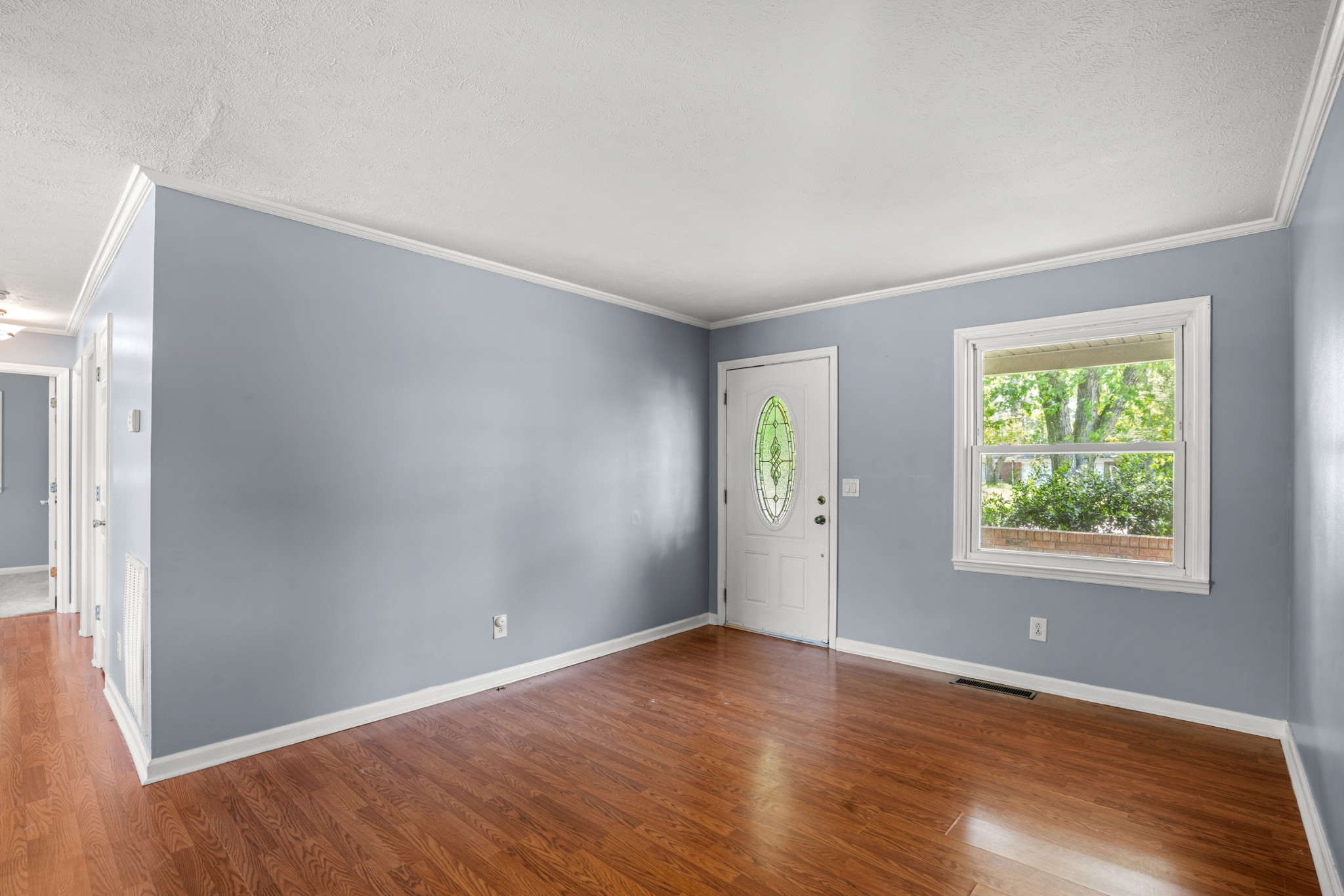 1106 State Highway 48 Dickson, TN 37055 - Photo 11 of 36 an empty room with wooden floor and windows