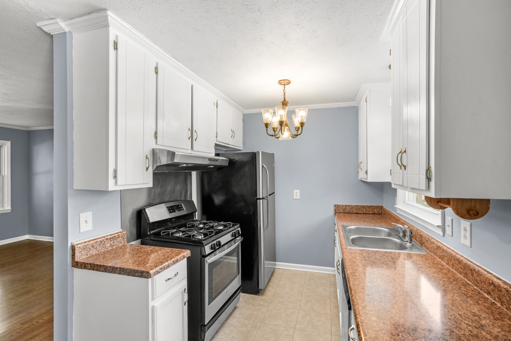 1106 State Highway 48 Dickson, TN 37055 - Photo 16 of 36 a kitchen with stainless steel appliances granite countertop a stove and a sink