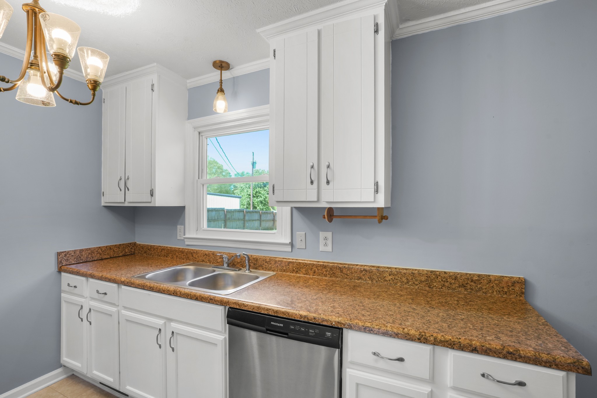 1106 State Highway 48 Dickson, TN 37055 - Photo 17 of 36 a kitchen with granite countertop white cabinets and white appliances