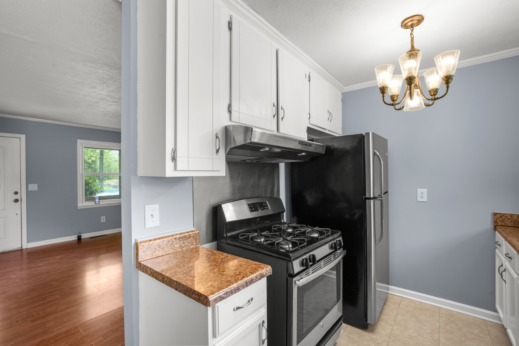 1106 State Highway 48 Dickson, TN 37055 - Photo 18 of 36 a kitchen with stainless steel appliances granite countertop a stove a sink and a microwave