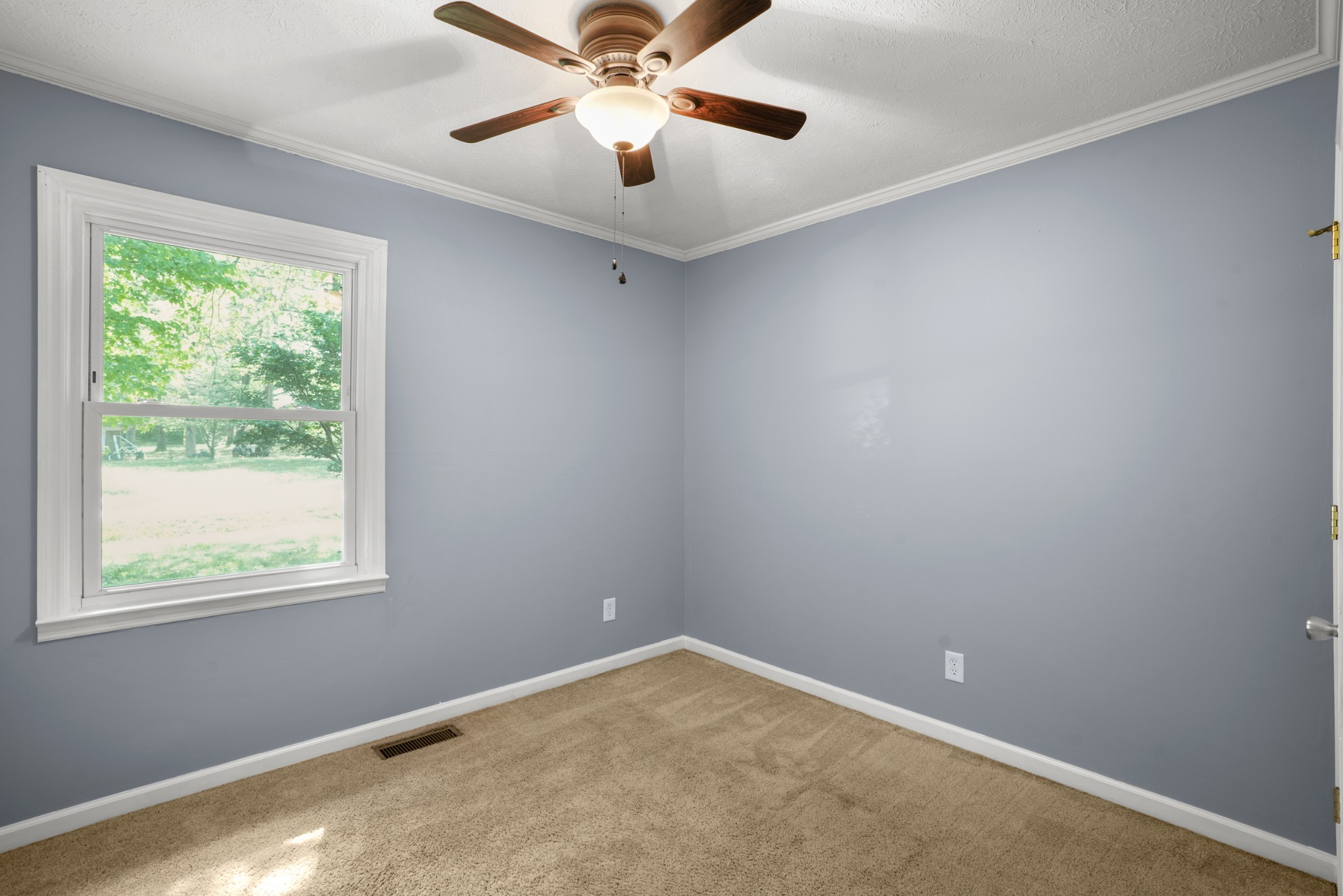 1106 State Highway 48 Dickson, TN 37055 - Photo 22 of 36 an empty room with a window and a fan