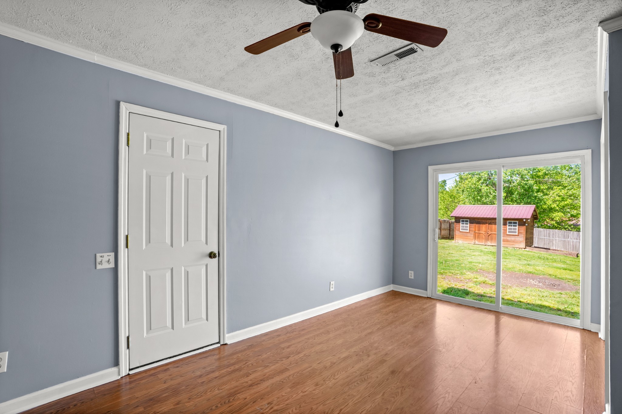 1106 State Highway 48 Dickson, TN 37055 - Photo 27 of 36 an empty room with wooden floor fan and windows