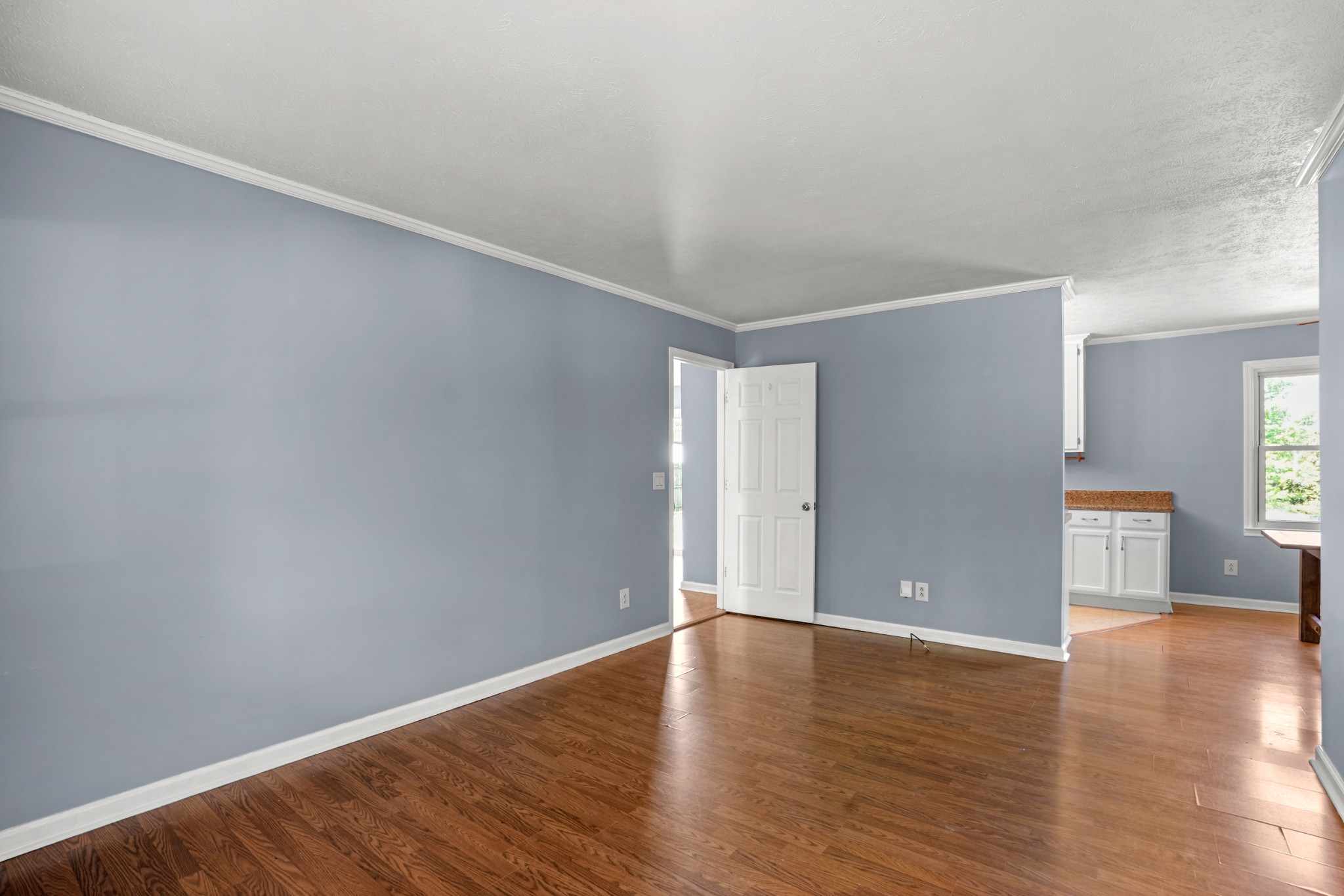 1106 State Highway 48 Dickson, TN 37055 - Photo 10 of 36 a view of an empty room with wooden floor and windows