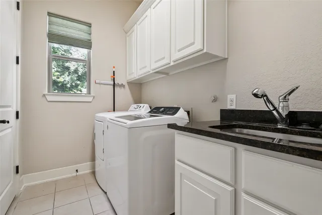 a utility room with closet dryer and washer