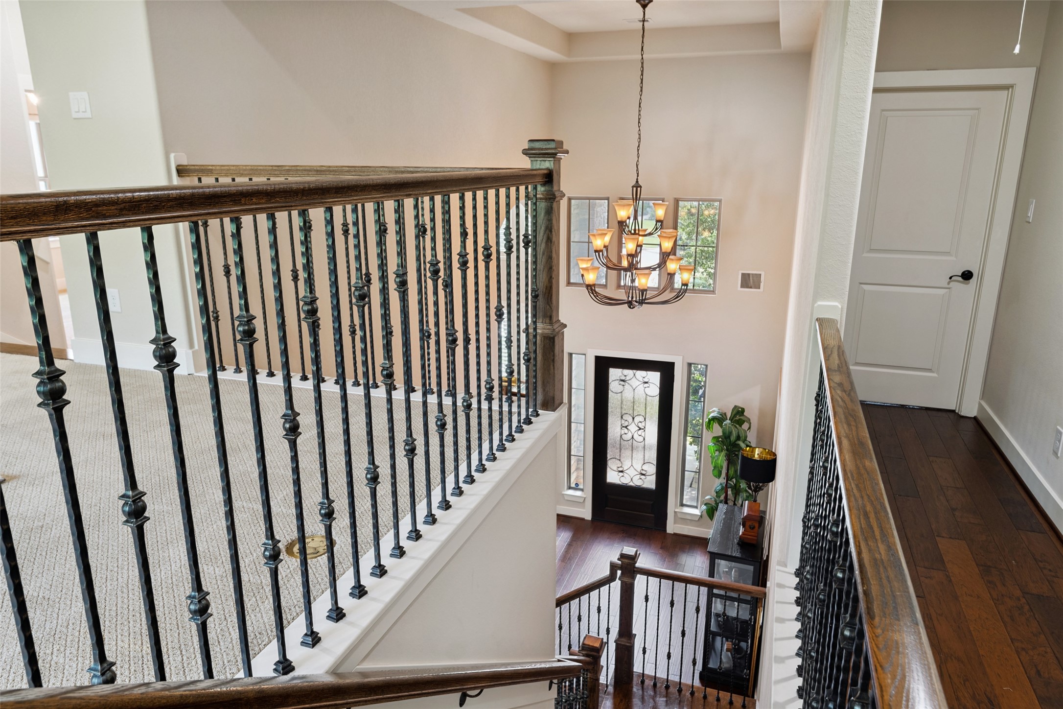 6510 Fraser Point Court Spring, TX 77379 - Photo 2 of 35 a view of a hallway with wooden floor and stairs