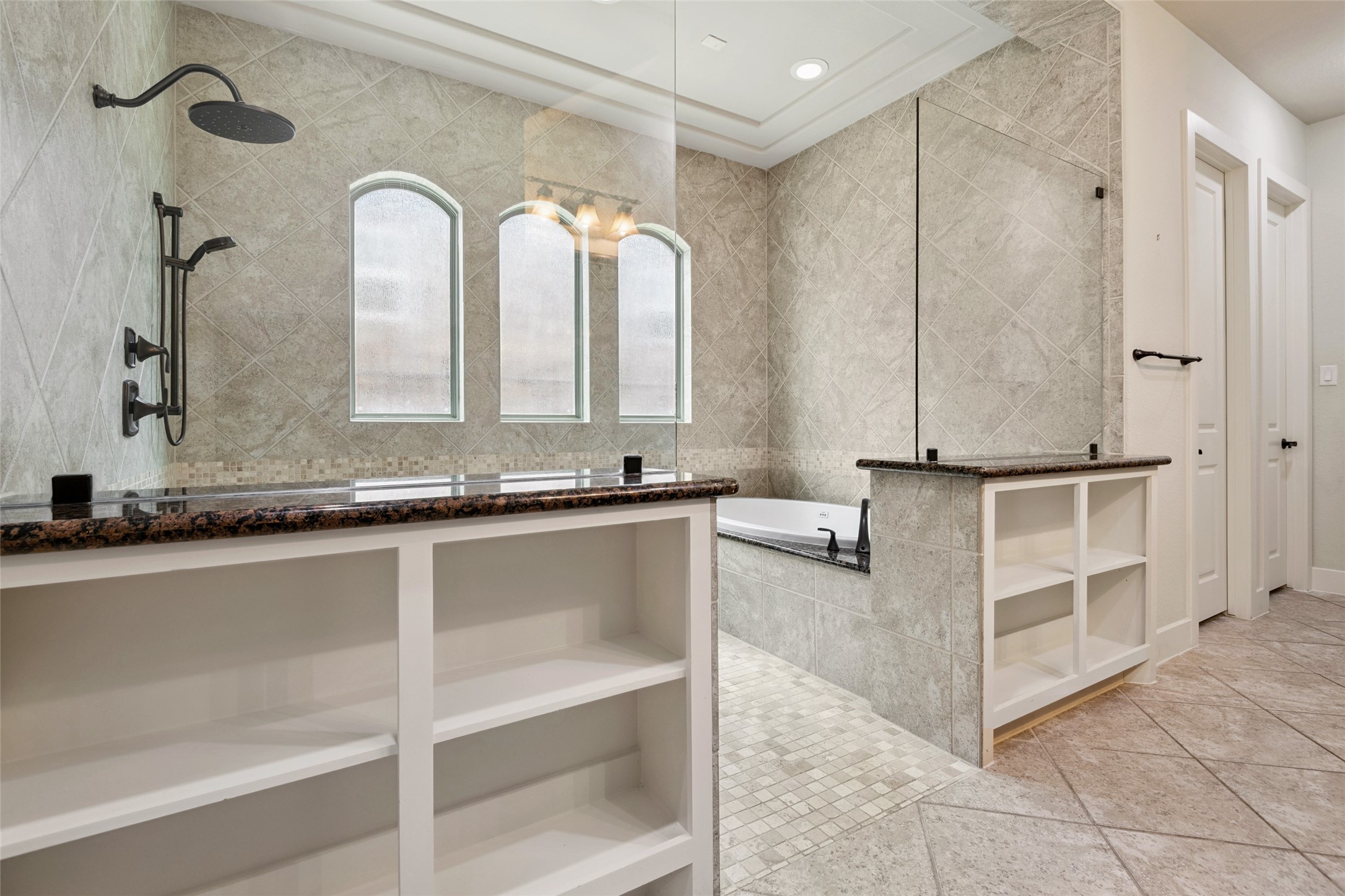 6510 Fraser Point Court Spring, TX 77379 - Photo 22 of 35 a bathroom with a double vanity sink a mirror and a bathtub