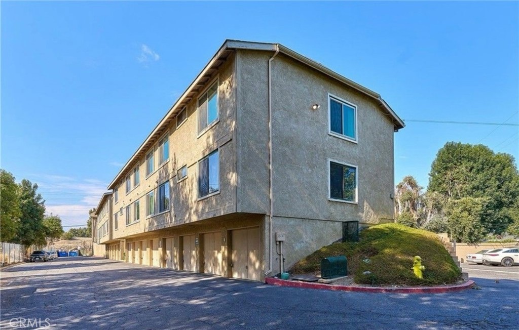 626 Bridgeport Circle, Unit 6 Fullerton, CA 92833 - Photo 6 of 6 a front view of a house with a yard
