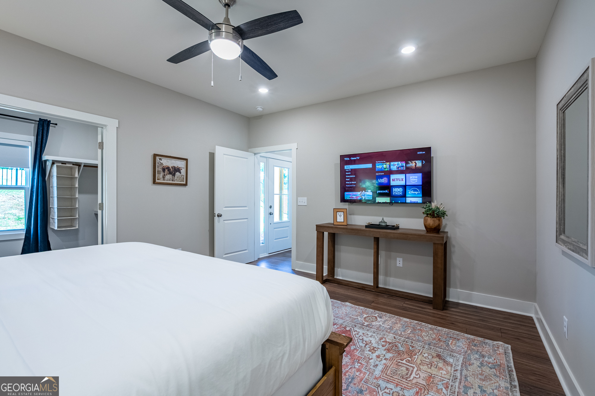 143 Old Alabama Road Southeast Emerson, GA 30137 - Photo 19 of 48 a bedroom with a bed and a flat screen tv