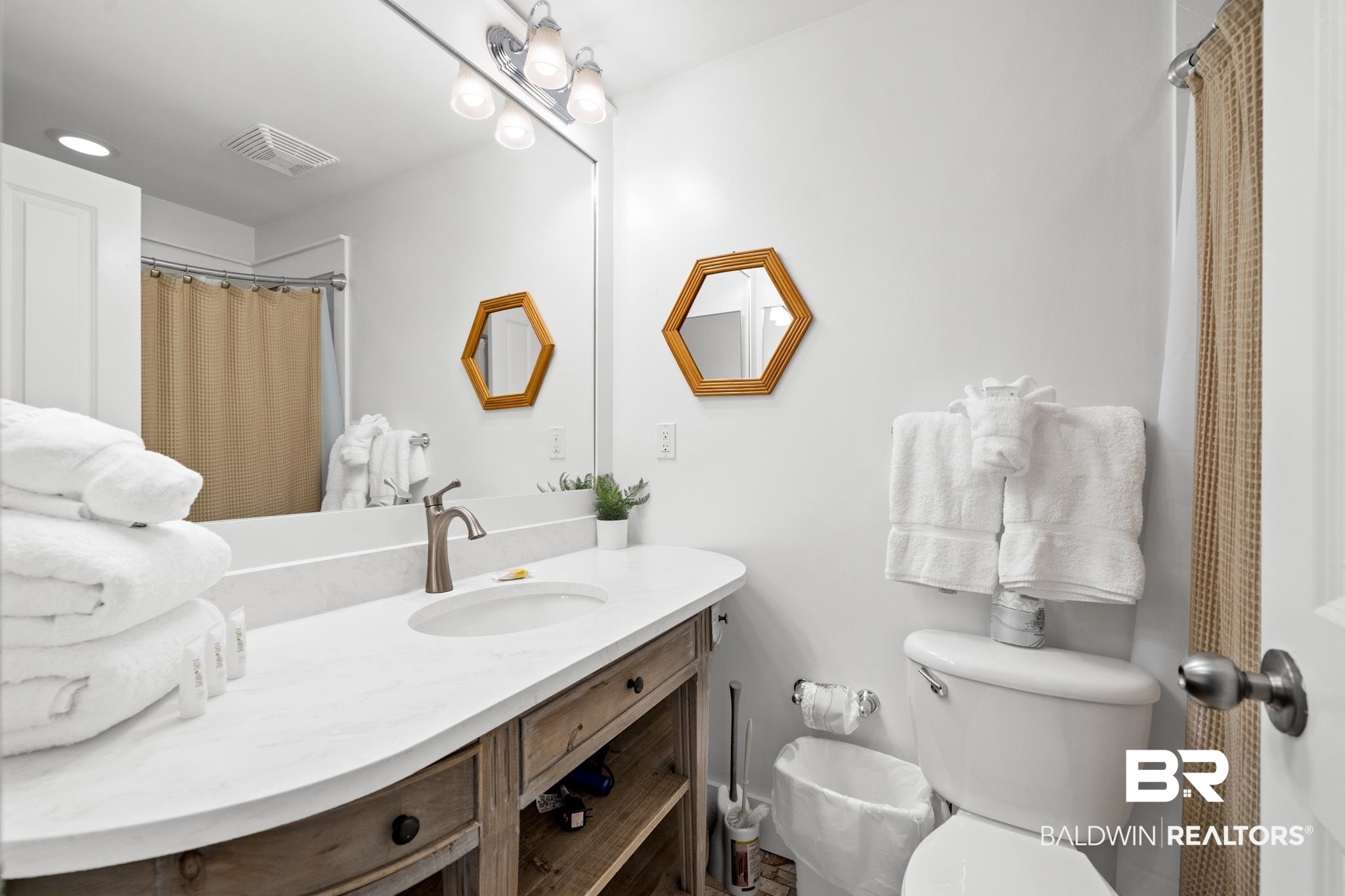 815 Plantation Road, Unit 301 Gulf Shores, AL 36542 - Photo 9 of 29 Bathroom with visible vents, toilet, and vanity
