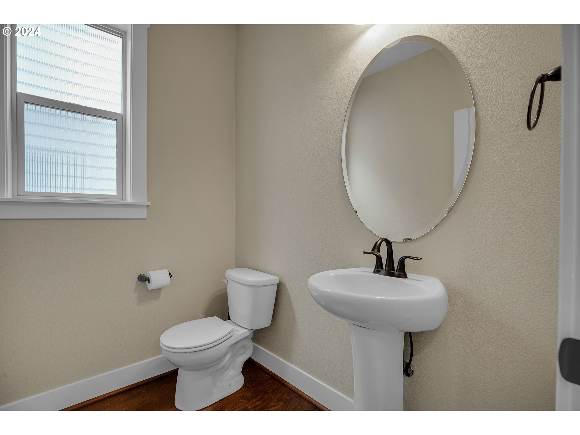 16937 Southwest Friendly Lane Beaverton, OR 97007 - Photo 14 of 44 a bathroom with a toilet sink and mirror