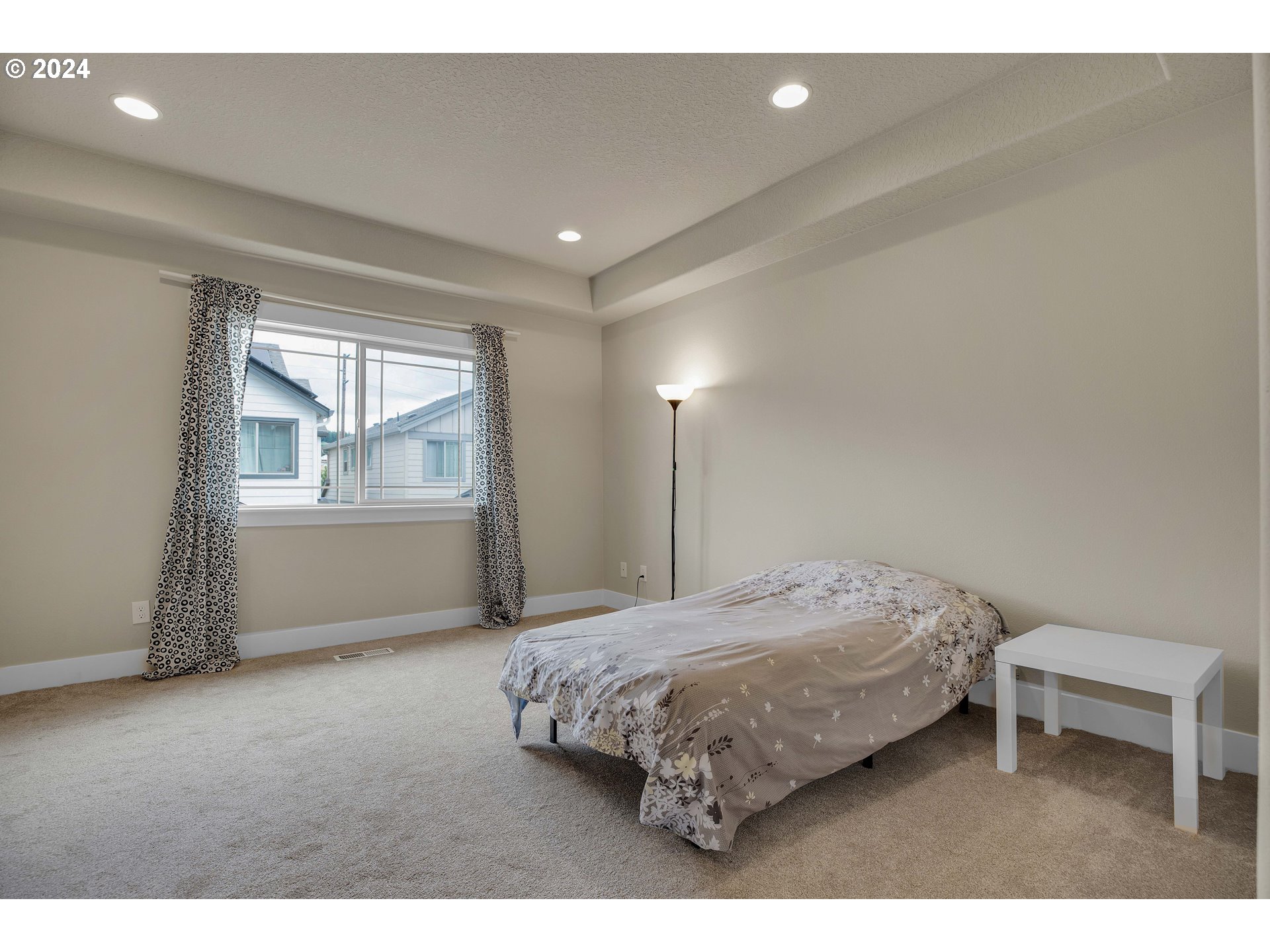 16937 Southwest Friendly Lane Beaverton, OR 97007 - Photo 16 of 44 a bedroom with a bed and a window