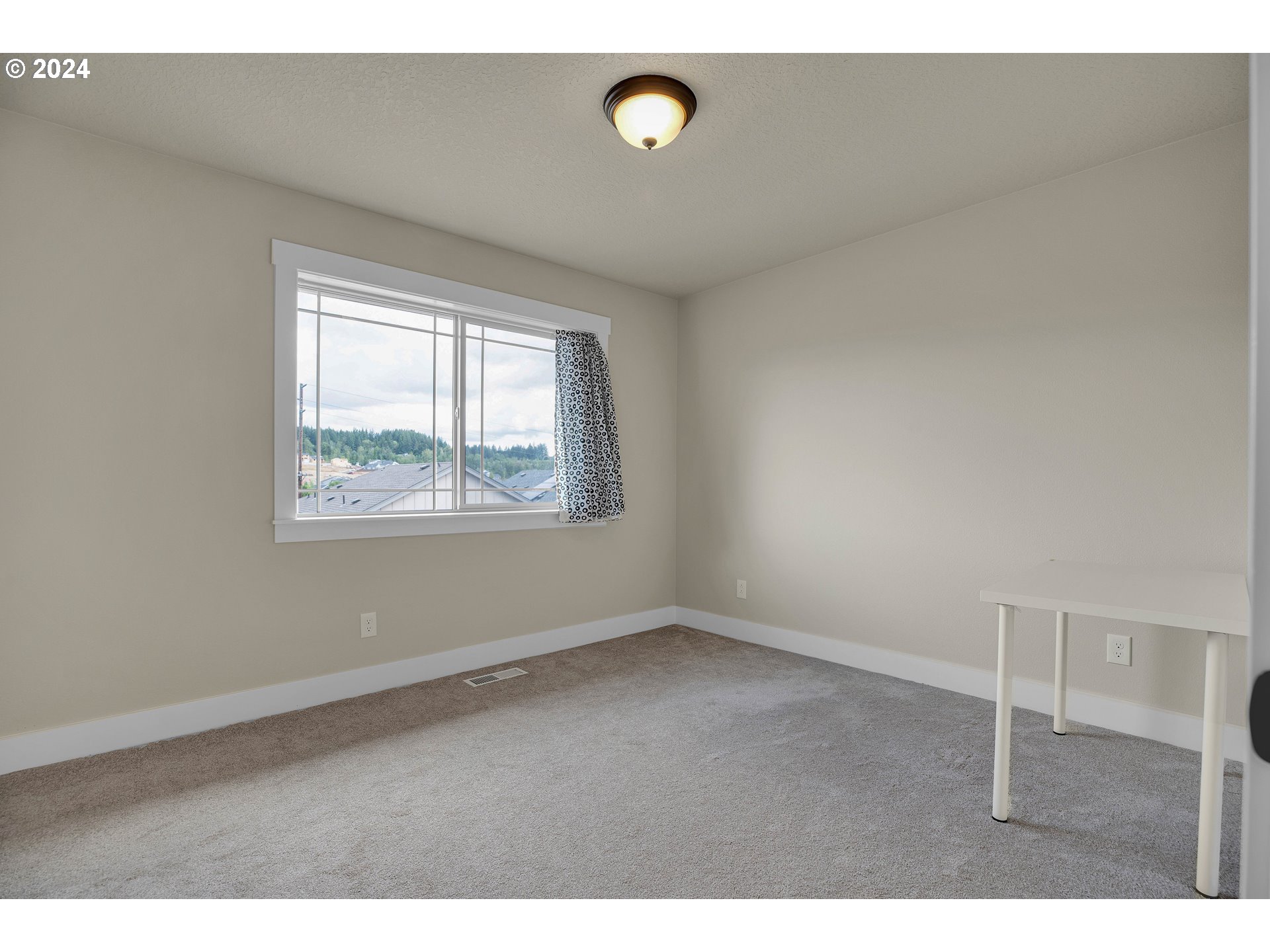 16937 Southwest Friendly Lane Beaverton, OR 97007 - Photo 20 of 44 a view of an empty room with a window