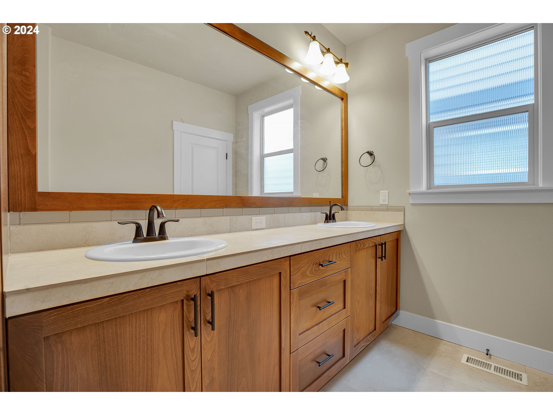 16937 Southwest Friendly Lane Beaverton, OR 97007 - Photo 21 of 44 a bathroom with a sink and a mirror
