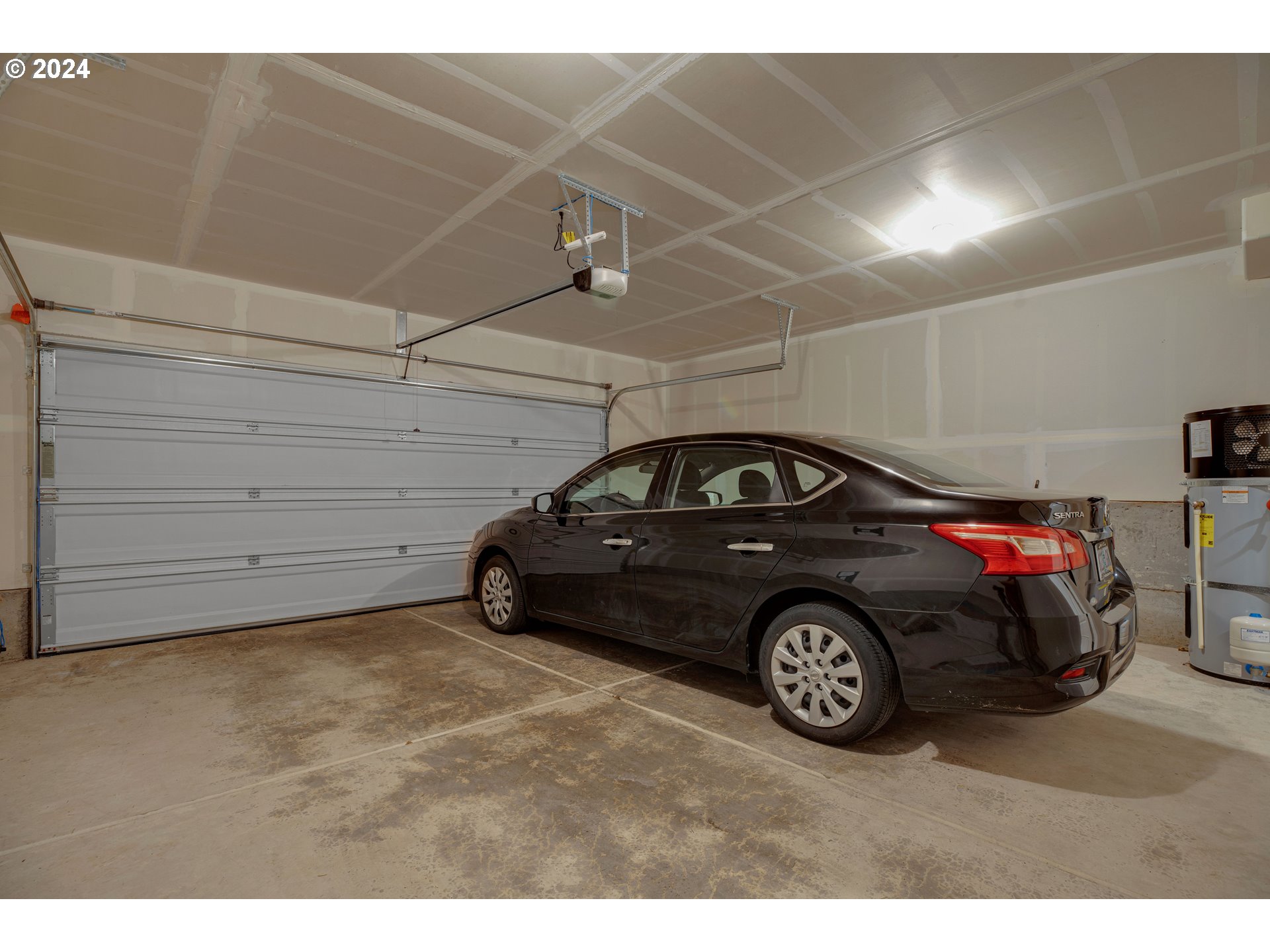 16937 Southwest Friendly Lane Beaverton, OR 97007 - Photo 28 of 44 a car parked in a garage
