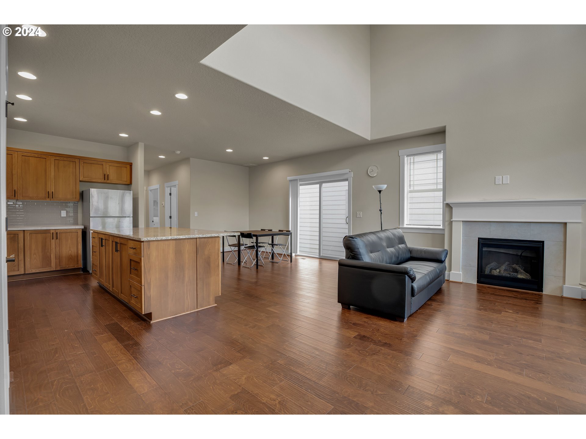 16937 Southwest Friendly Lane Beaverton, OR 97007 - Photo 3 of 44 a living room with furniture and a fireplace