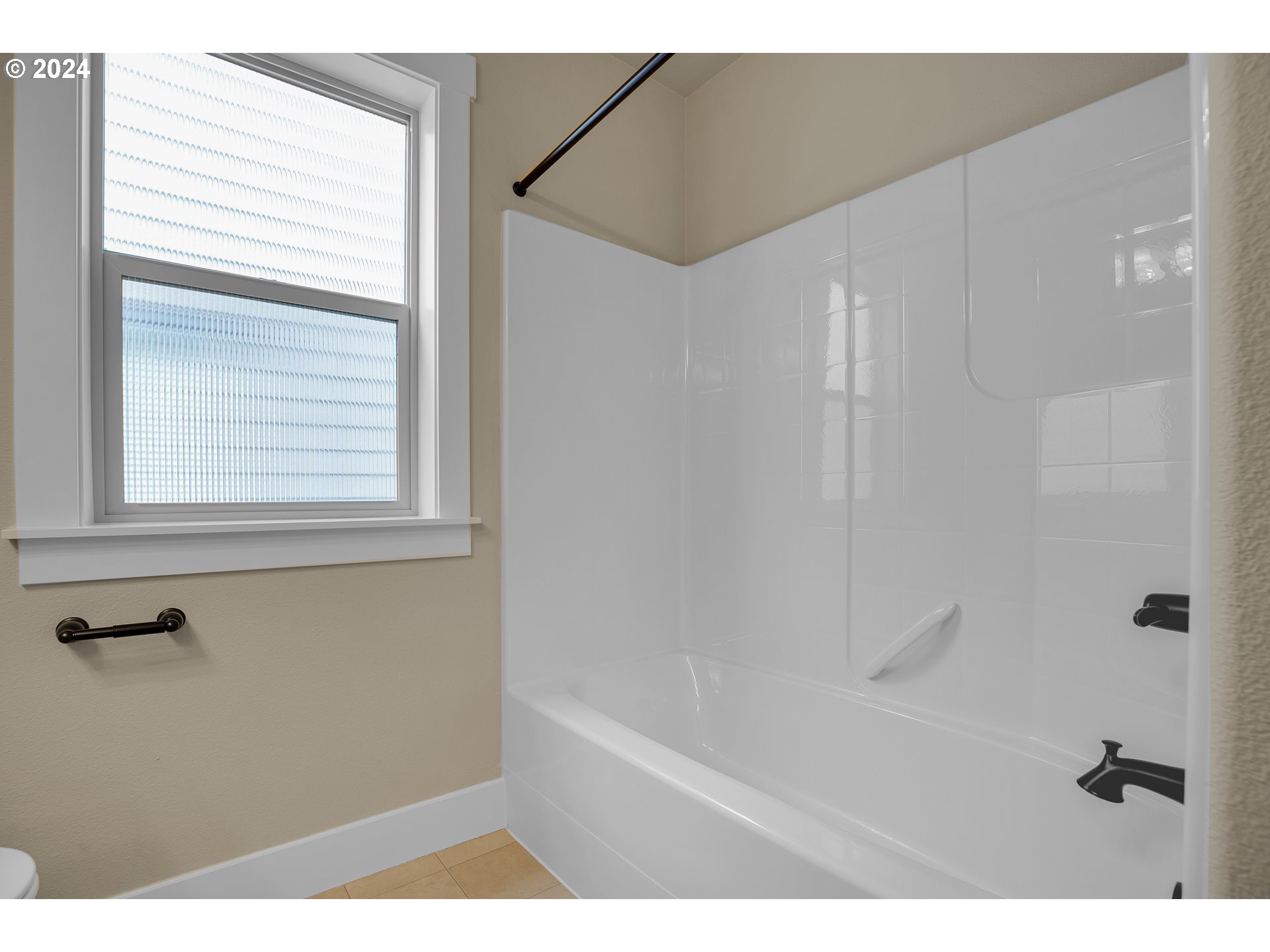 16937 Southwest Friendly Lane Beaverton, OR 97007 - Photo 33 of 44 a bathroom with a bathtub